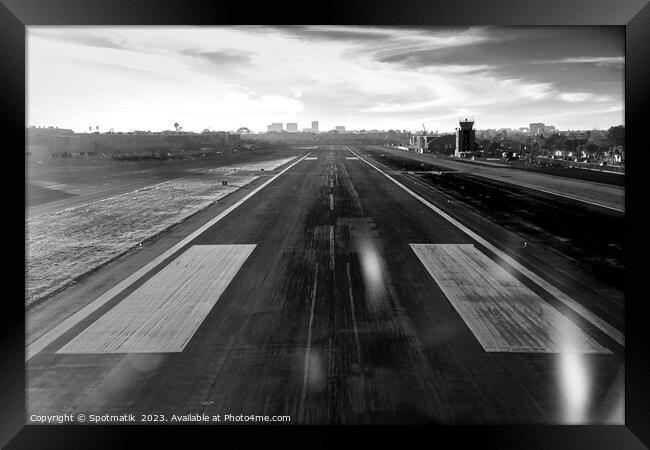 Aerial POV of aircraft landing on airport runway  Framed Print by Spotmatik 
