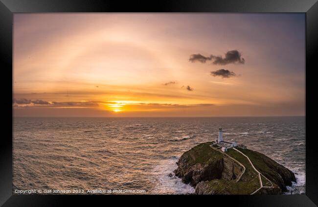 Rough weather off the lighthouse at sunset Isle of Anglesey Nort Framed Print by Gail Johnson