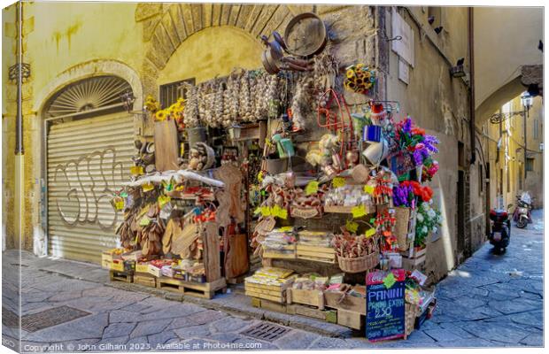 Pavement Shop in Florence Tuscany Italy Canvas Print by John Gilham