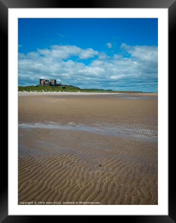 Bamburgh Castle on the horizon above Bamburgh beac Framed Mounted Print by Chris Rose