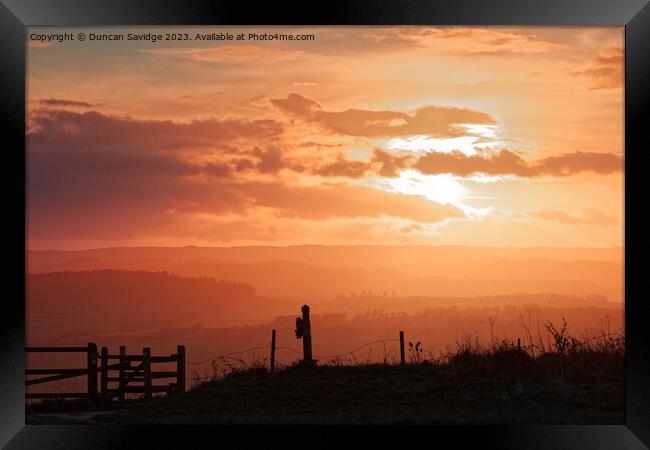 Hazy sunset looking towards the Mendips Framed Print by Duncan Savidge