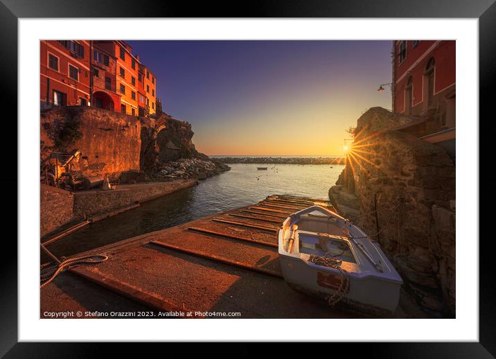 Riomaggiore village, a boat in front of the sea. Cinque Terre Framed Mounted Print by Stefano Orazzini