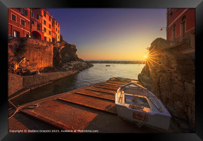 Riomaggiore village, a boat in front of the sea. Cinque Terre Framed Print by Stefano Orazzini