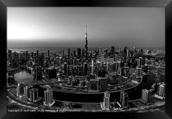 Aerial Dubai sunset city skyscrapers Burj Khalifa Framed Print by Spotmatik 