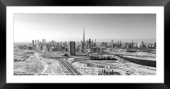 Aerial view of development Dubai city Skyline UAE  Framed Mounted Print by Spotmatik 