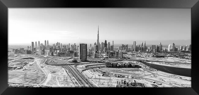 Aerial view of development Dubai city Skyline UAE  Framed Print by Spotmatik 