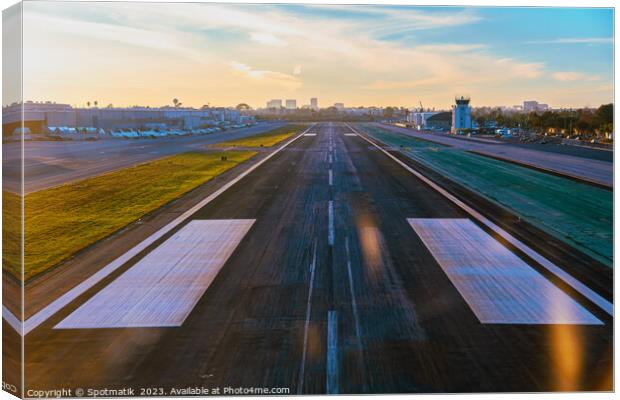Aerial POV aircraft landing on airport runway USA Canvas Print by Spotmatik 