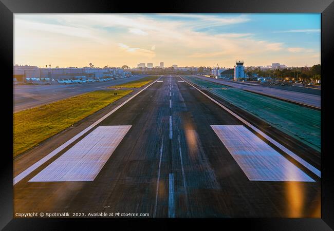 Aerial POV aircraft landing on airport runway USA Framed Print by Spotmatik 