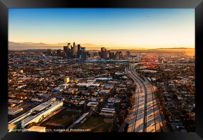 Aerial sunrise view of downtown Los Angeles Freeway  Framed Print by Spotmatik 