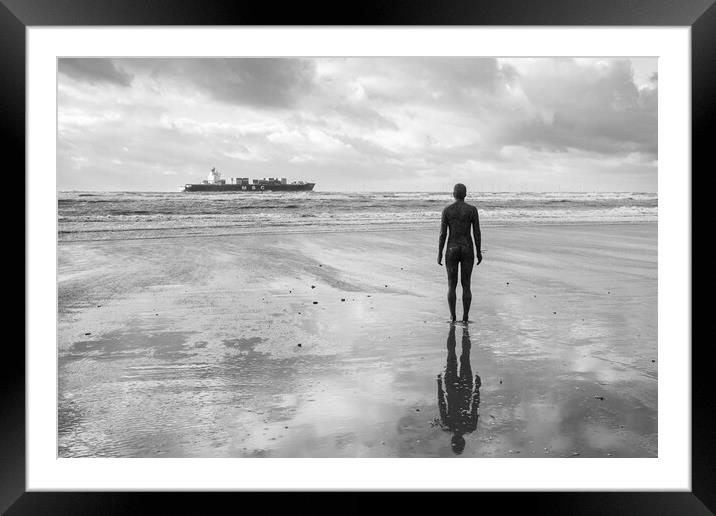 Iron Man watching a container ship passing by Framed Mounted Print by Jason Wells