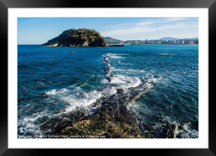 The sea beats hard on the coast and leaves visible geological fo Framed Mounted Print by Joaquin Corbalan