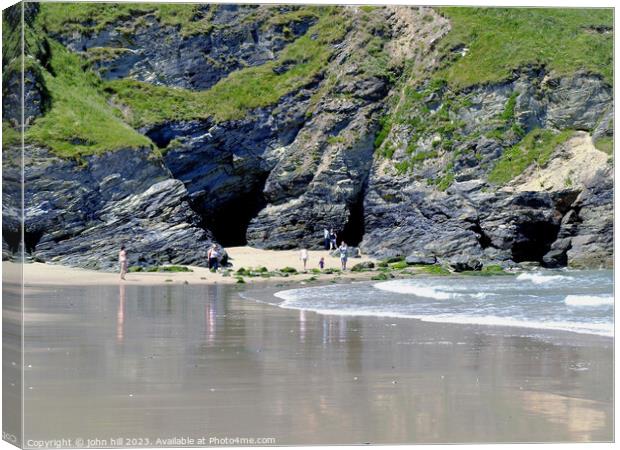 Exploring caves on Portreath beach. Canvas Print by john hill