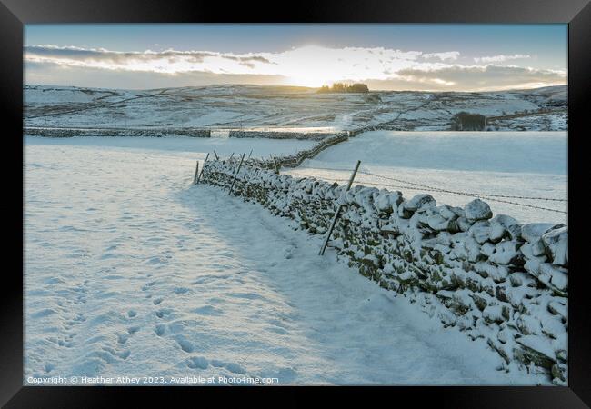 Snowy sunrise in Northumberland, UK Framed Print by Heather Athey