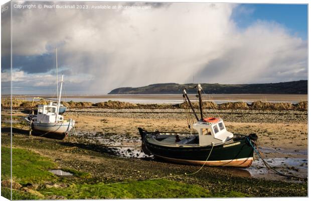 Grounded boats in Red Wharf Bay Anglesey Canvas Print by Pearl Bucknall