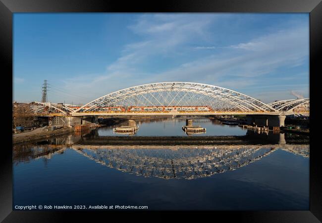 Krakow railway bridge reflections Framed Print by Rob Hawkins