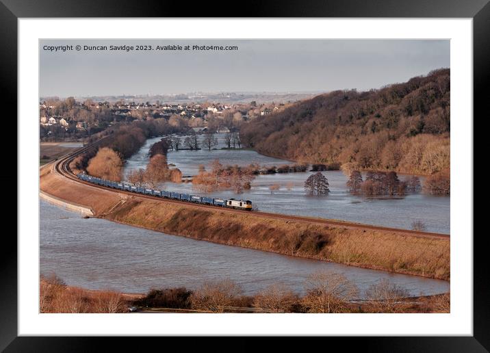 A freight train crosses flooded fields through Corston near Bath Framed Mounted Print by Duncan Savidge