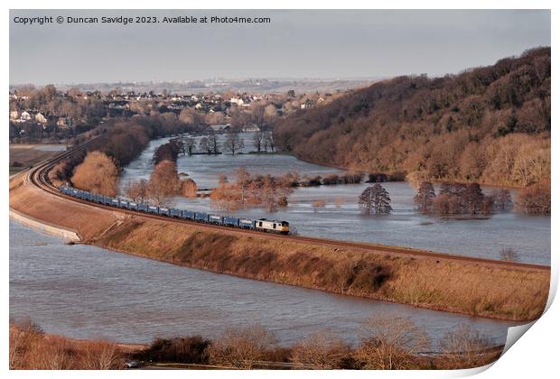 A freight train crosses flooded fields through Corston near Bath Print by Duncan Savidge