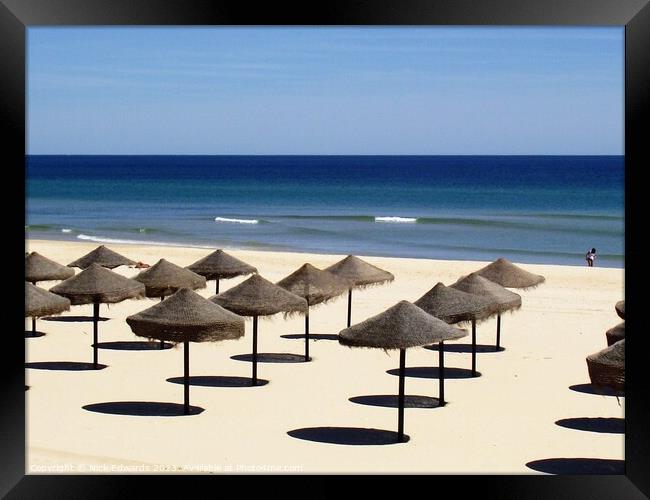 Algarve Beach Umbrellas in Rows Framed Print by Nick Edwards