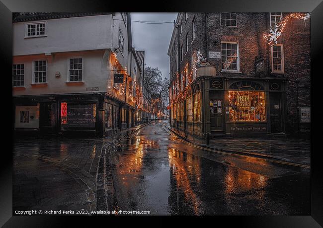 Rainy reflections in the streets of York Framed Print by Richard Perks