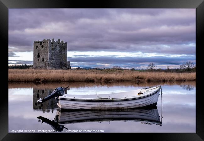 Boat moored on the river dee with Threave Castle in the background, Scotland Framed Print by SnapT Photography