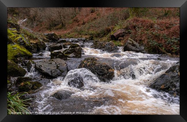 Winter runoff and fast turbulent water on a highland stream or burn in Scotland Framed Print by SnapT Photography
