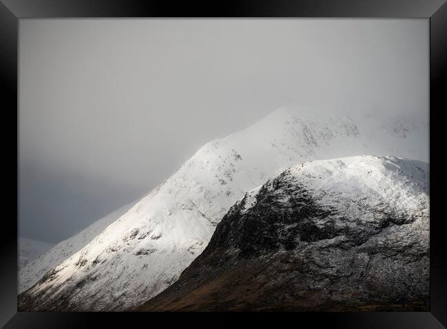 Snow covered mountains of Glencoe Framed Print by Anthony McGeever