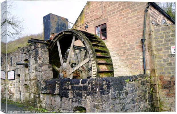 Old water wheel at Cromford, Derbyshire Canvas Print by john hill