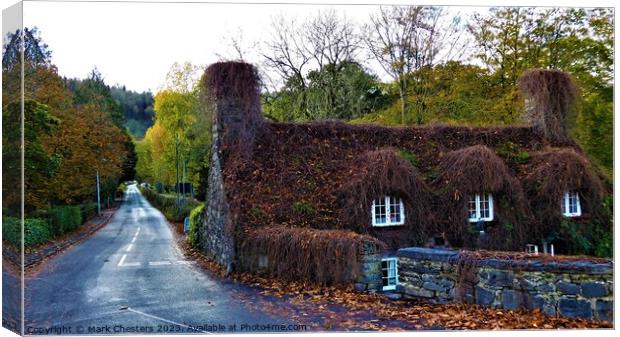A Timeless Cottage Amidst Nature Canvas Print by Mark Chesters