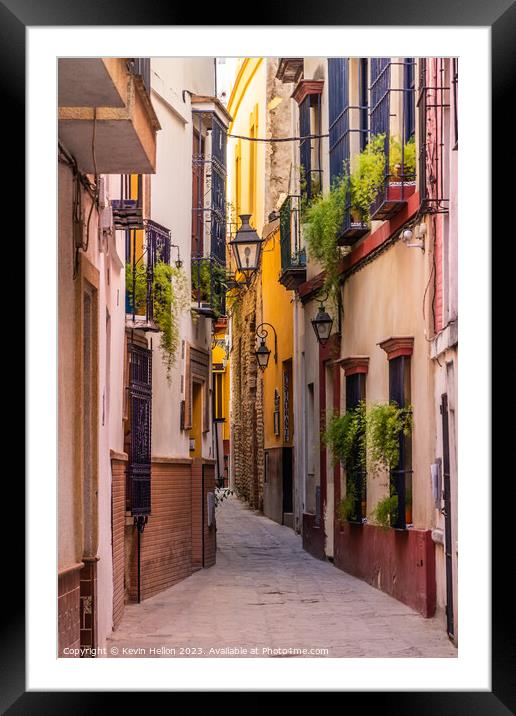 Narrow street in Seville, Spain Framed Mounted Print by Kevin Hellon