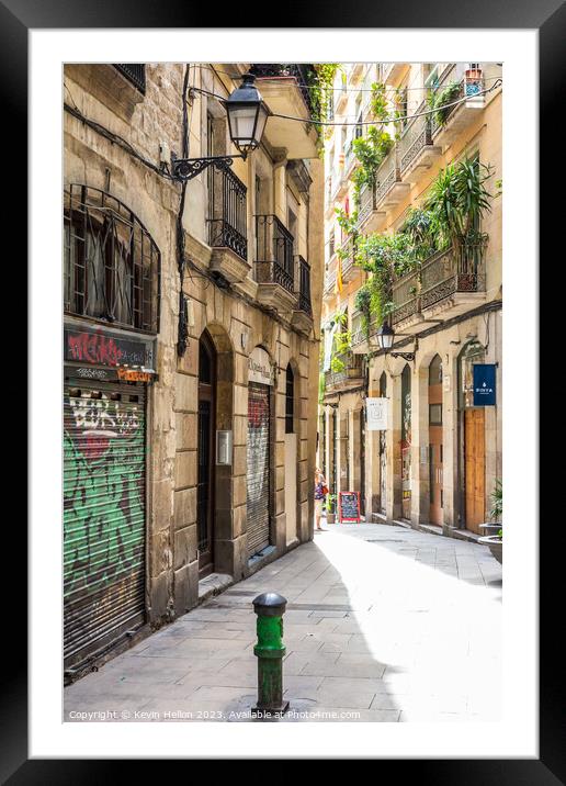 Typical narrow street in the Gothic quarter of Barcelona, Spain Framed Mounted Print by Kevin Hellon