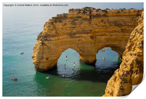 Kayaks and sup boards peddling under the Arco Natural on the Algarve coast in Portugal. Print by Kristof Bellens