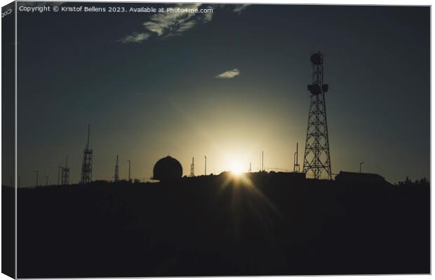 Silhouette of communication towers against a sunset. Canvas Print by Kristof Bellens