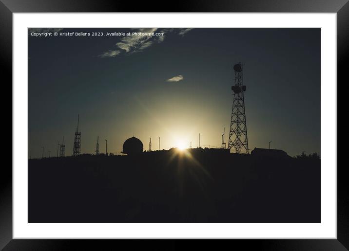Silhouette of communication towers against a sunset. Framed Mounted Print by Kristof Bellens