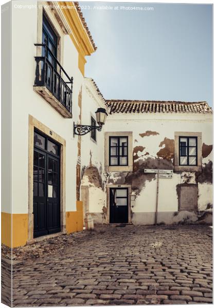 View on one of the cozy cobblestoned alleys of the old town Faro in Portugal Canvas Print by Kristof Bellens