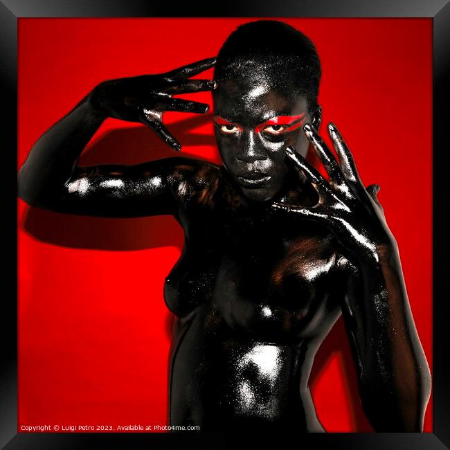 Black model covered in black body paint. Framed Print by Luigi Petro