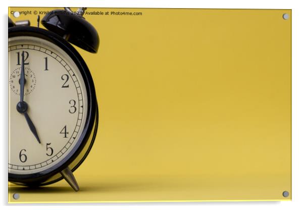 Analog alarm clock displaying five o'clock on a yellow background with copy space Acrylic by Kristof Bellens