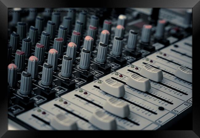 Closeup and detail of audio mixing console with faders and knobs Framed Print by Kristof Bellens