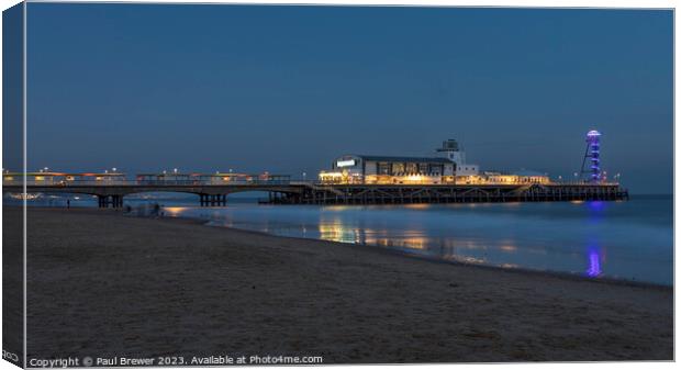 Bournemouth Pier at night Canvas Print by Paul Brewer