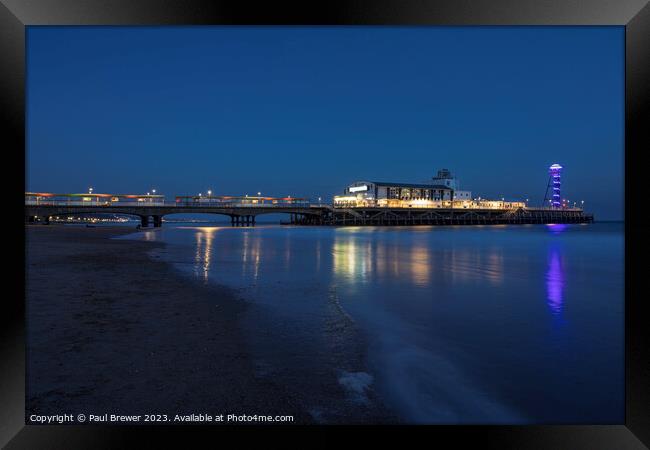 Bournemouth Pier at night Framed Print by Paul Brewer