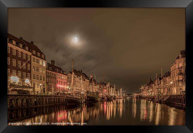 The moon is shining over the Nyhavn Canal in Copenhagen Framed Print by Stig Alenäs