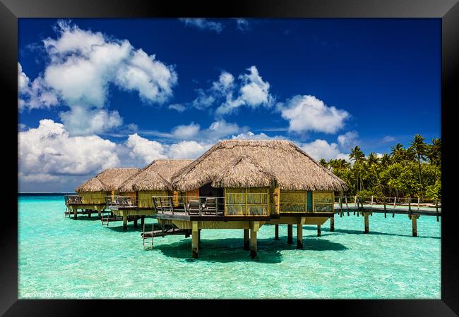 Bora Bora luxury holiday resort with Overwater Bungalows  Framed Print by Spotmatik 