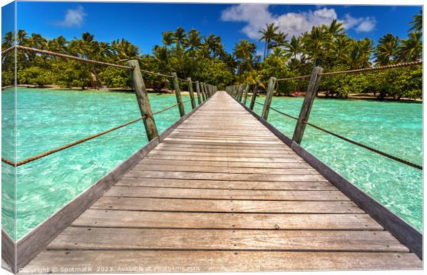 Bora Bora wooden walkway over tropical Aquamarine lagoon  Canvas Print by Spotmatik 