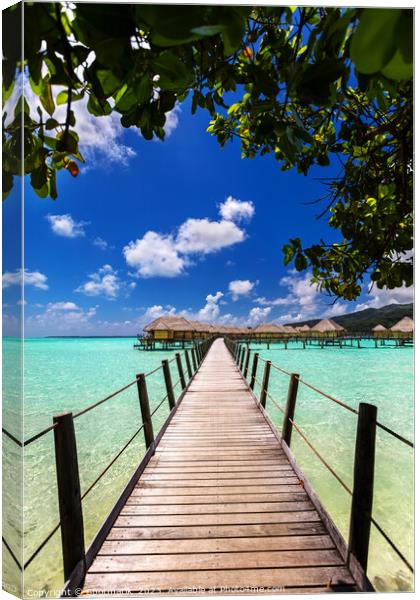 Bora Bora walkway across lagoon luxury Overwater bungalows  Canvas Print by Spotmatik 