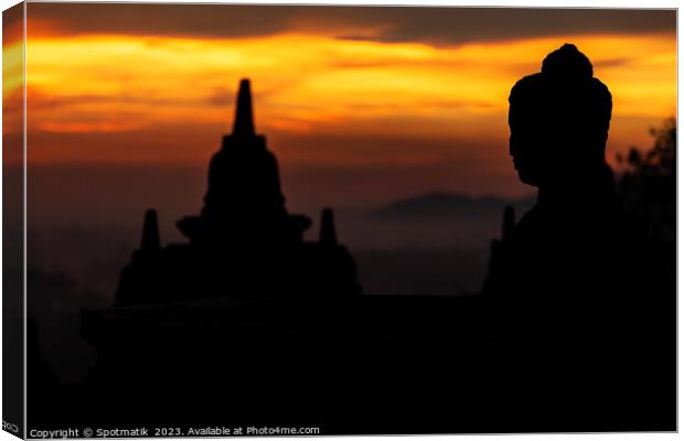 Silhouette at sunrise of Borobudur religious temple Indonesia  Canvas Print by Spotmatik 