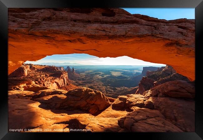 View of the rising sun Mesa sandstone Arch  Framed Print by Spotmatik 