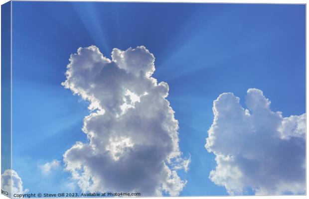 White and Grey Clouds with Sunrays Shining Through. Canvas Print by Steve Gill