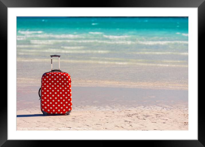 Red polka dot travel luggage on sand beach Framed Mounted Print by Spotmatik 