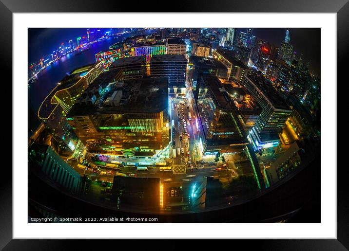 Hong Kong illuminated city traffic and skyscrapers downtown Framed Mounted Print by Spotmatik 