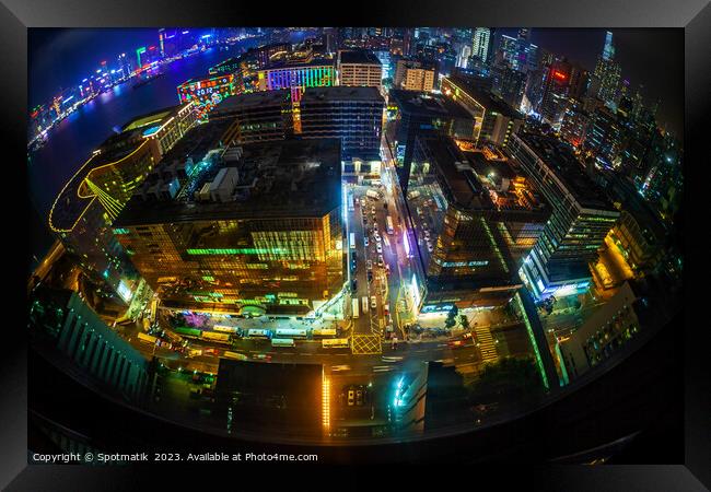 Hong Kong illuminated city traffic and skyscrapers downtown Framed Print by Spotmatik 