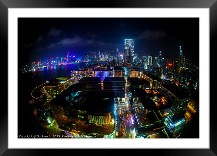 Hong Kong illuminated city traffic and skyscrapers downtown  Framed Mounted Print by Spotmatik 